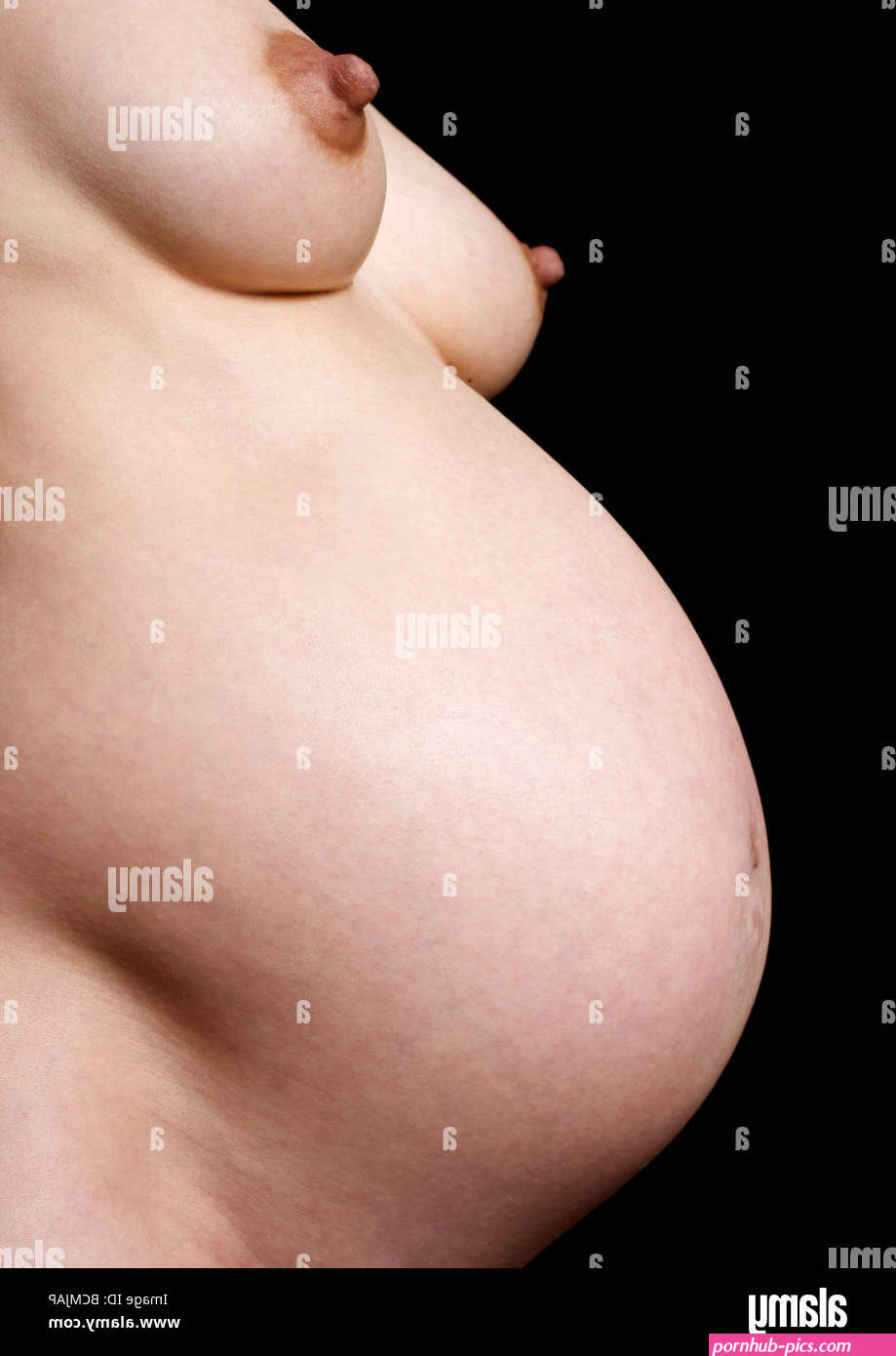 Close-up of nude, pregnant woman at 38 weeks Stock Photo
