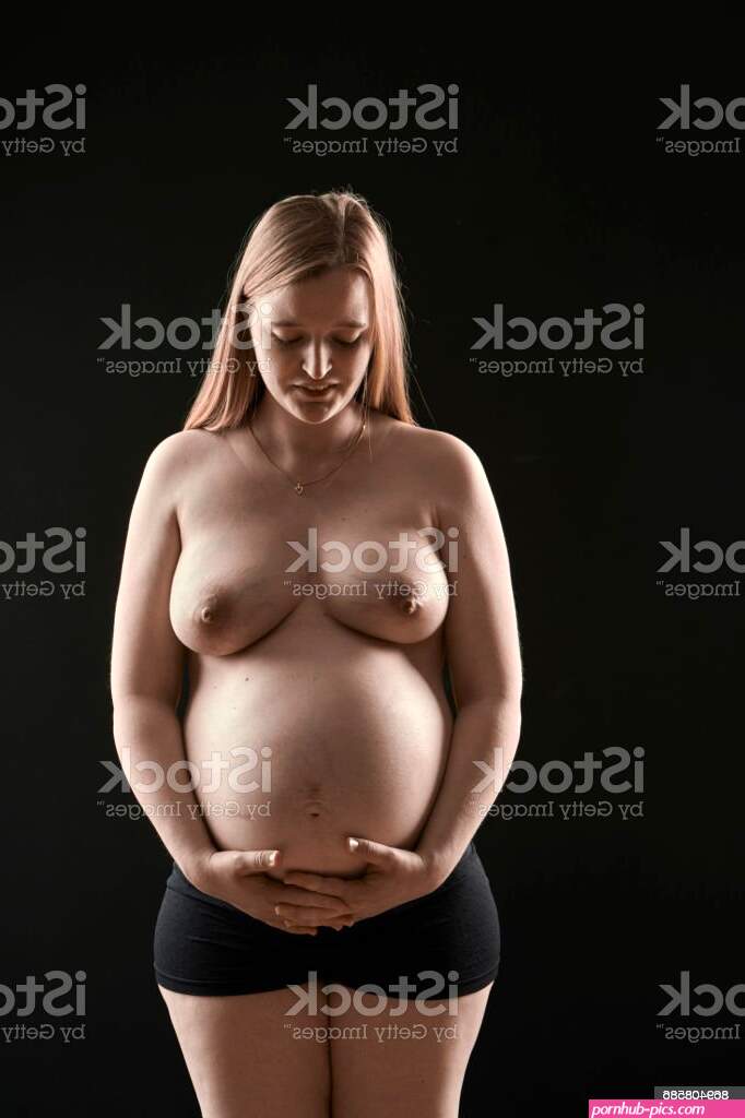 Pregnant Young Blond Woman In Front View Stock Photo