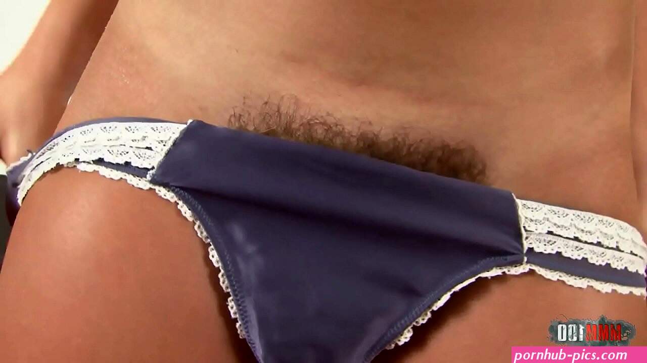 When she removes her panties she reveals a beautiful hairy pussy!