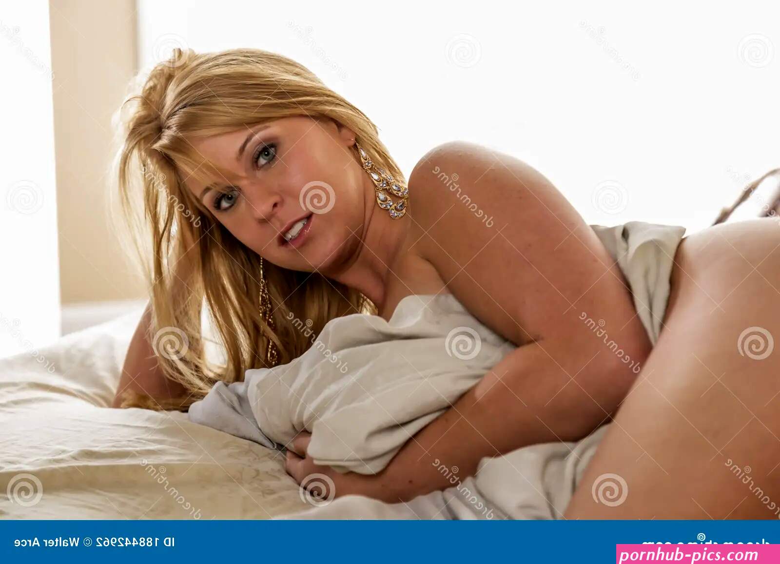 Gorgeous Blonde Model Poses Nude in a Home Environment Stock Photo