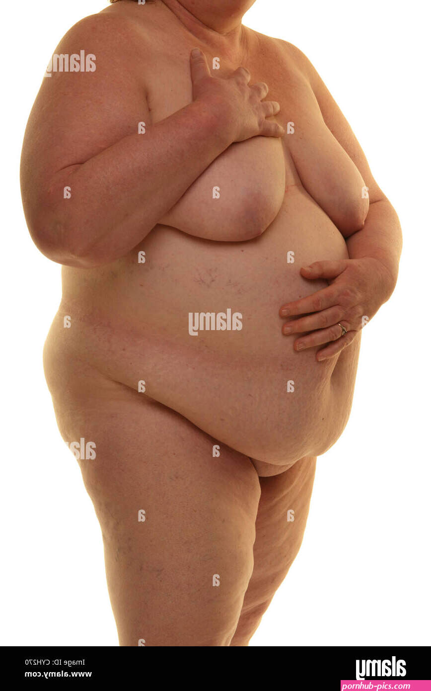 Fat naked woman standing against a white background Stock Photo
