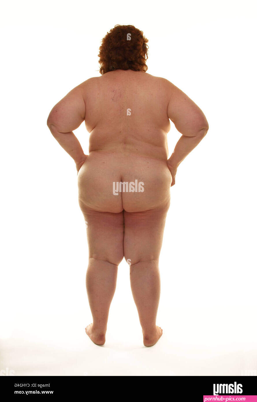 Fat naked woman standing against a white background Stock Photo