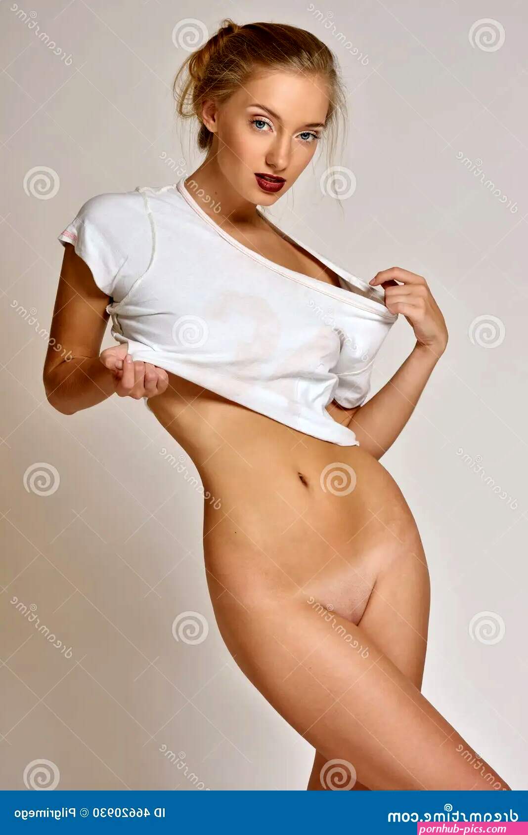 Beautiful Naked Blonde Woman in White T-shirt. Stock Photo