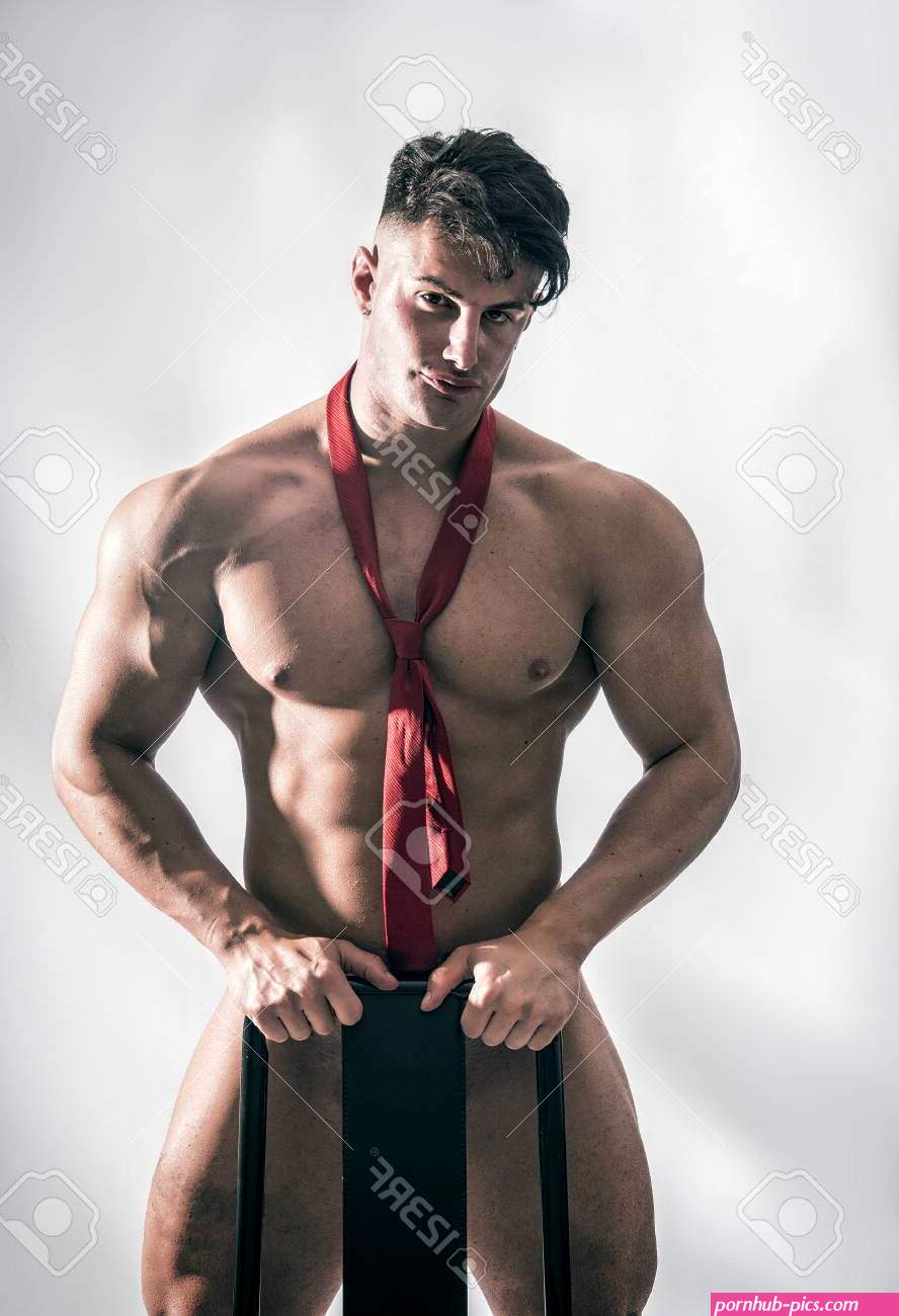 Muscular Bodybuilder Standing Behind Chair Totally Naked Looking At Camera -. Image 122129436