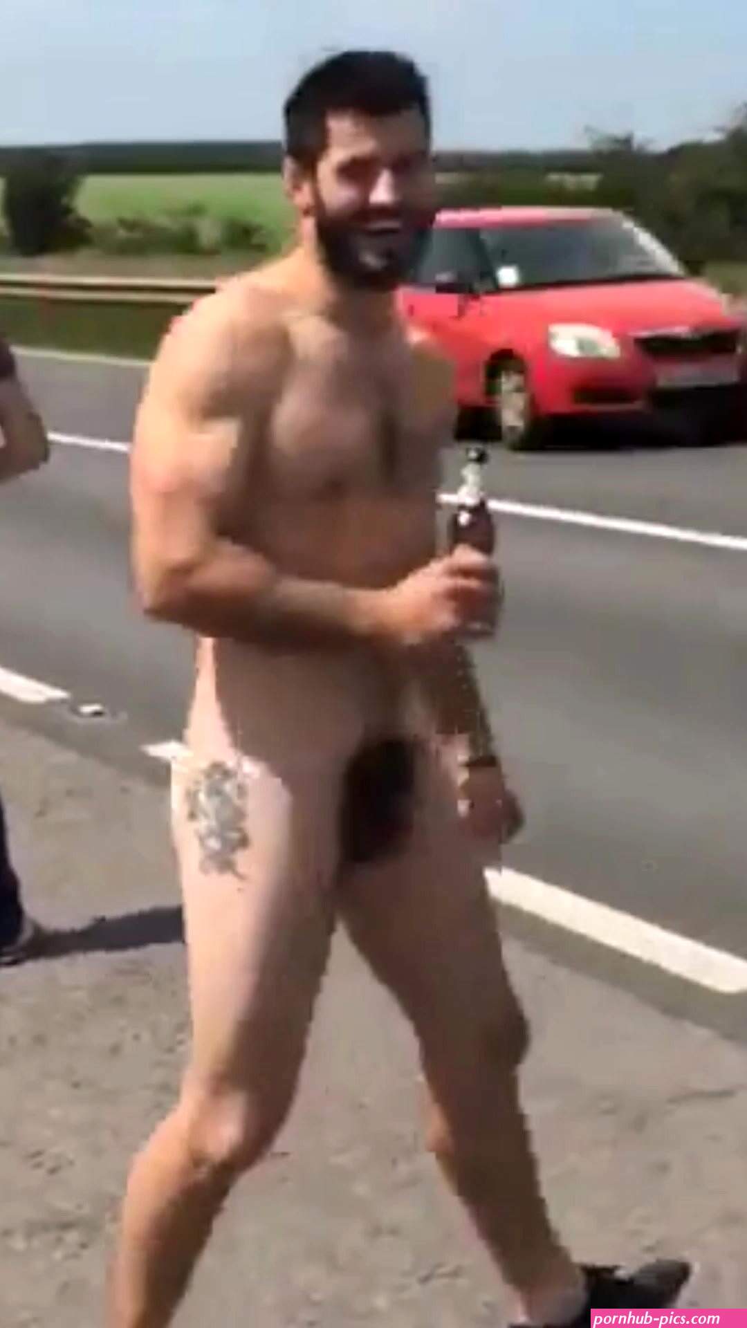 Muscle hairy man naked in public road