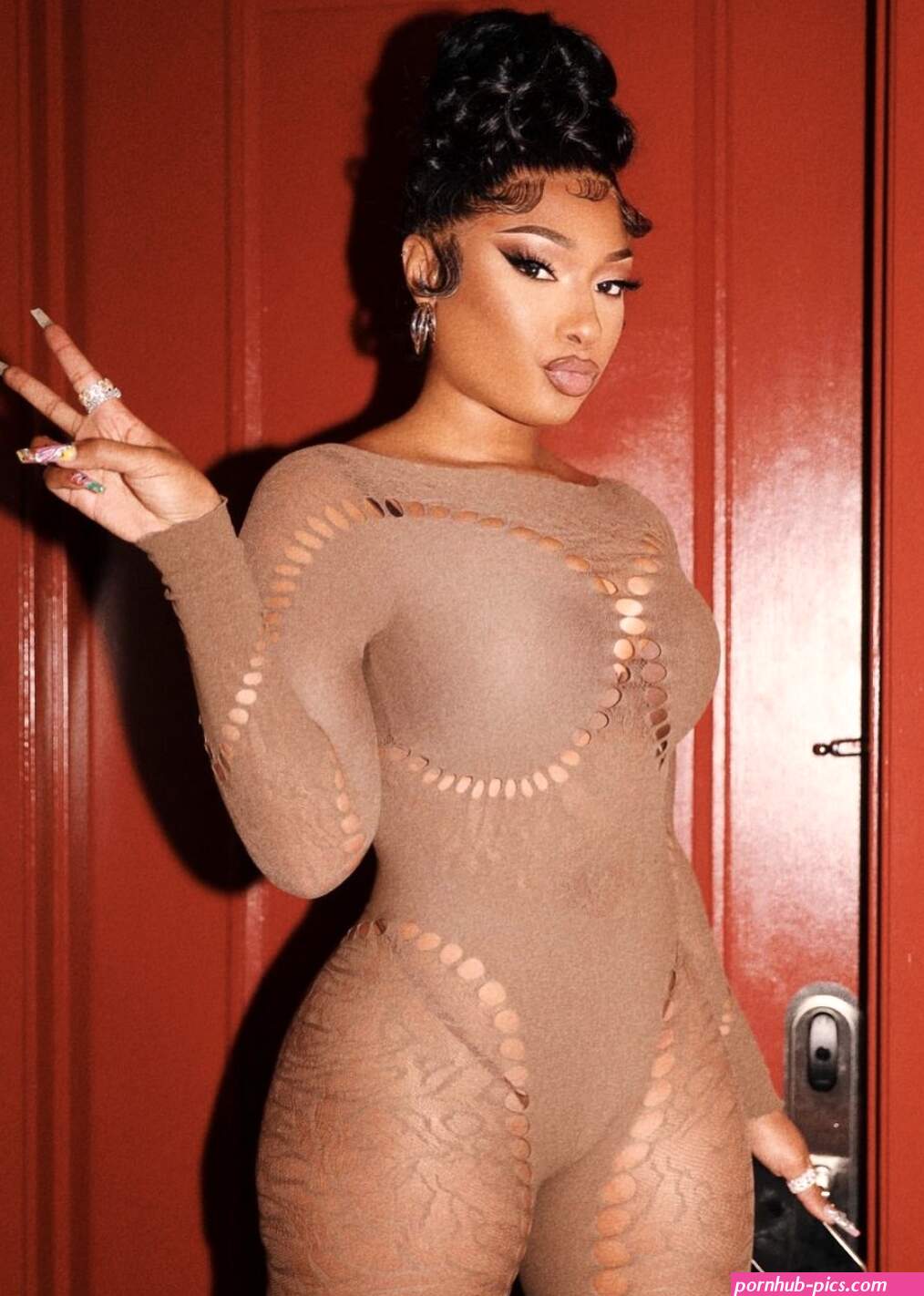 See Megan Thee Stallion's Sultry Flare-Leg Taupe Jumpsuit