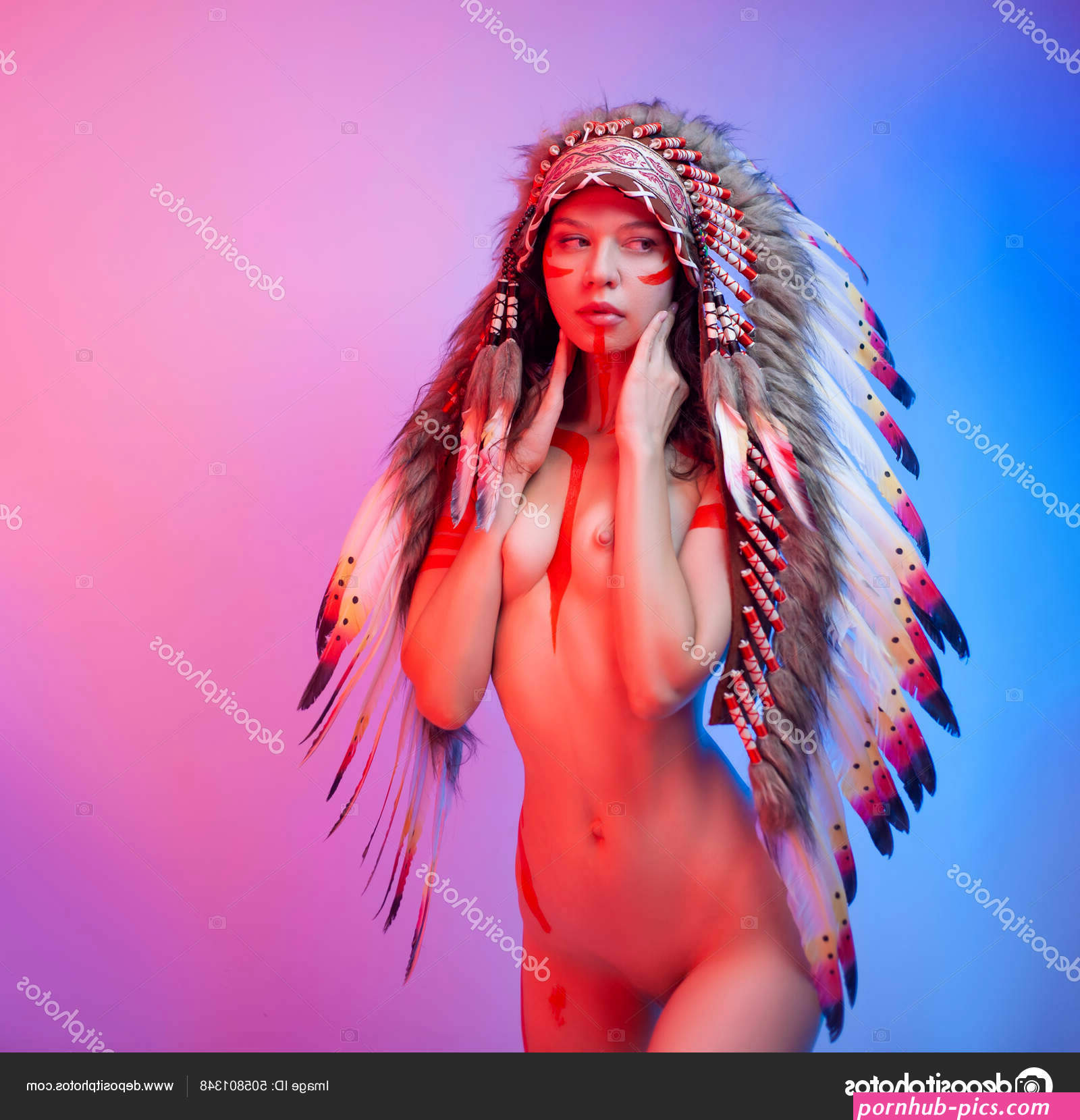 Naked woman in native american costume with feathers on a neon background Stock Photo by artrotozwork 505801348