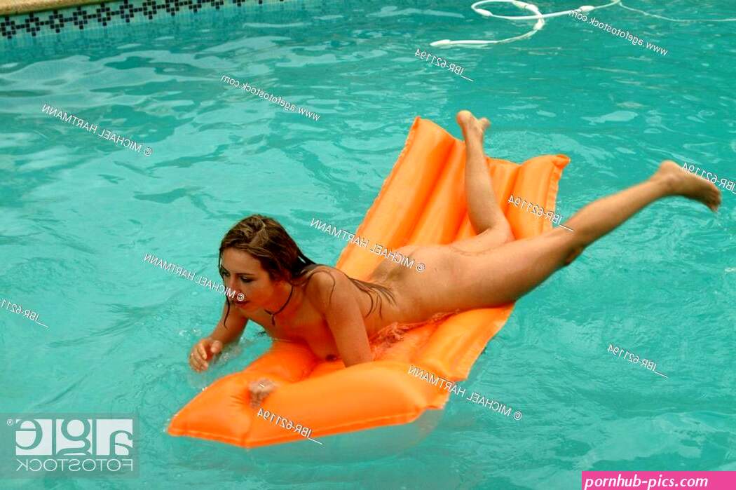 Young nude woman splashing around swimming pool on air mattress Stock Photo Picture And Rights Managed Image. Pic. IBR-621194