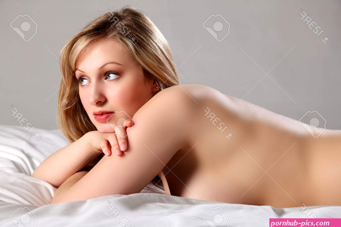 Voluptuous Beautiful Young Blonde Woman With Blue Eyes Lying Naked In Bed. Picture Has Been Retouched For Air Brushed Look. Stock Photo Picture and Royalty Free Image. Image 9683025.