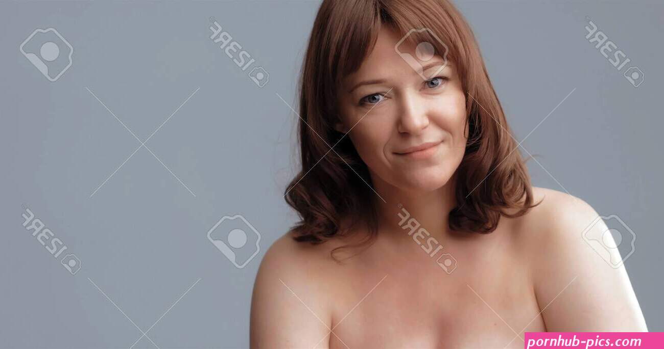 Beautiful Nude Woman Smiles Looking At Camera. Mature Woman With Perfect Skin Isolated On Grey Background. Beauty And Spa Concept. -. Image 150233442