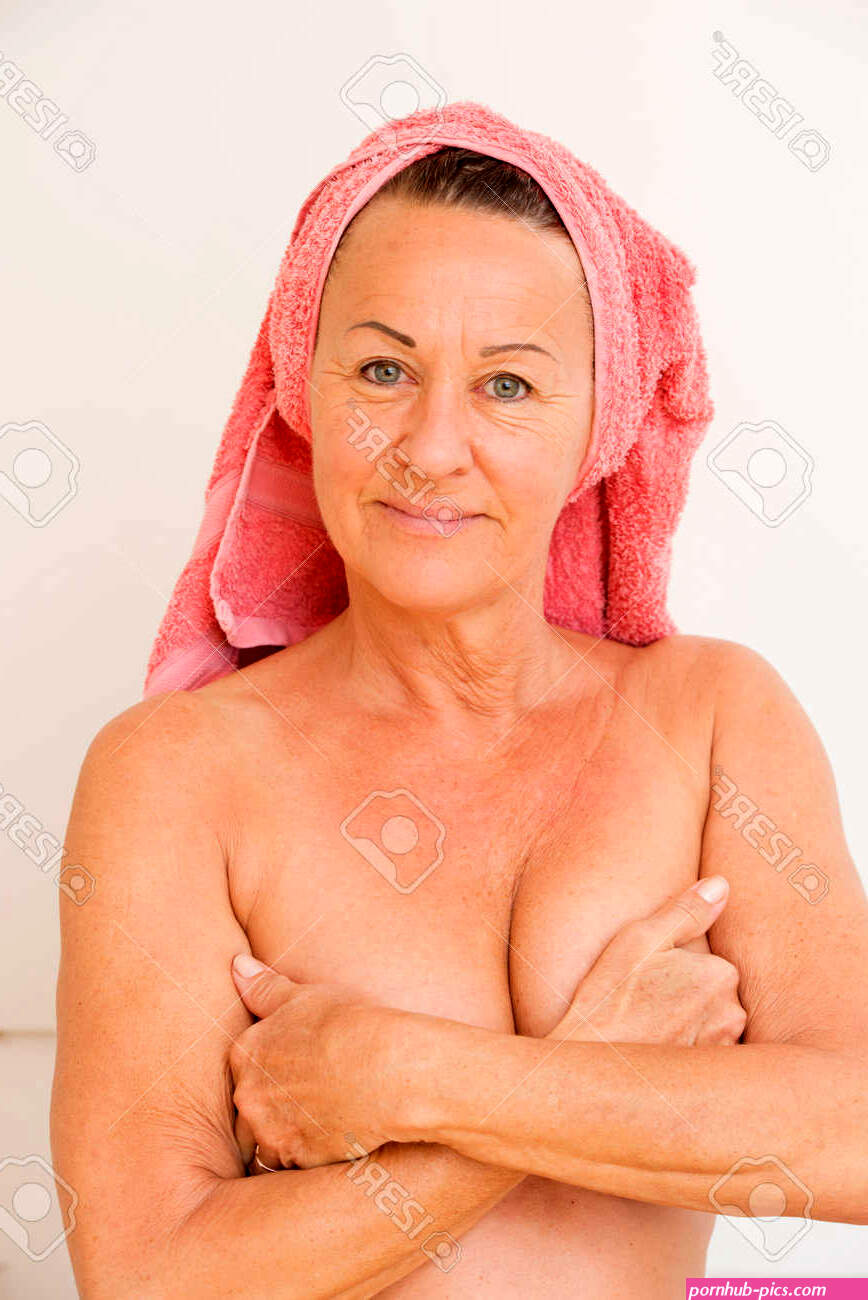 Portrait Happy Beautiful Mature Woman Naked With Towel On Head And Covering Her Breasts With Hands Relaxed And Friendly Smiling Isolated On White. Stock Photo Picture and Royalty Free Image. Image 23445776.
