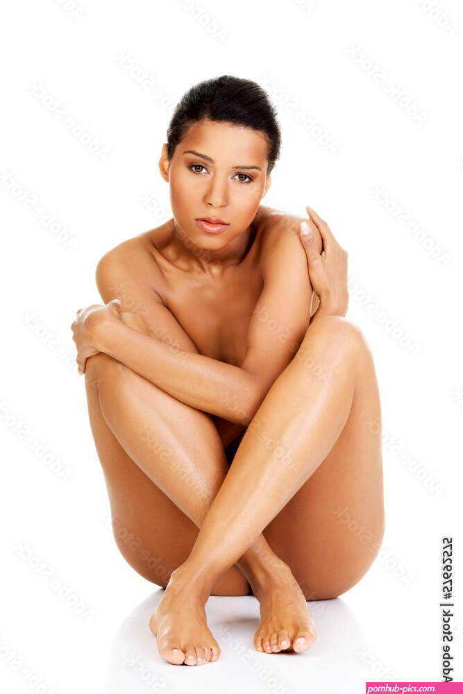 Beautiful and naked women sitting and covering her nudity by her Stock Photo