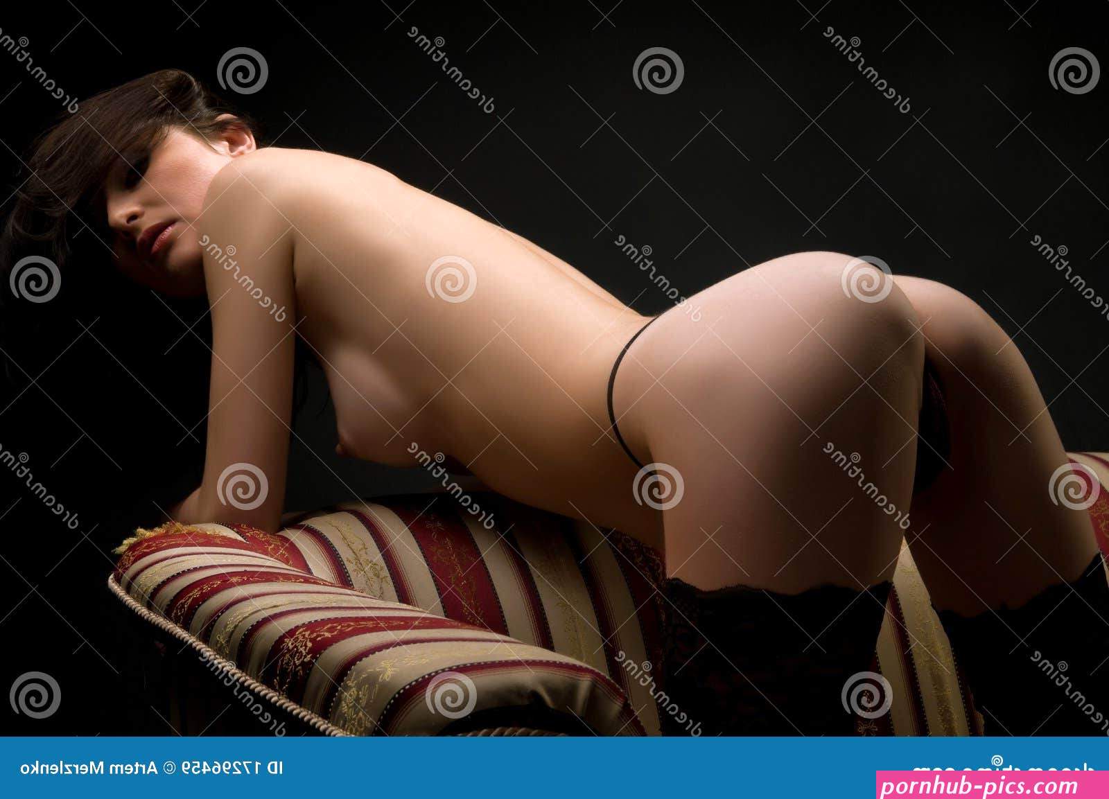 Naked Brunette on the Couch Stock Image
