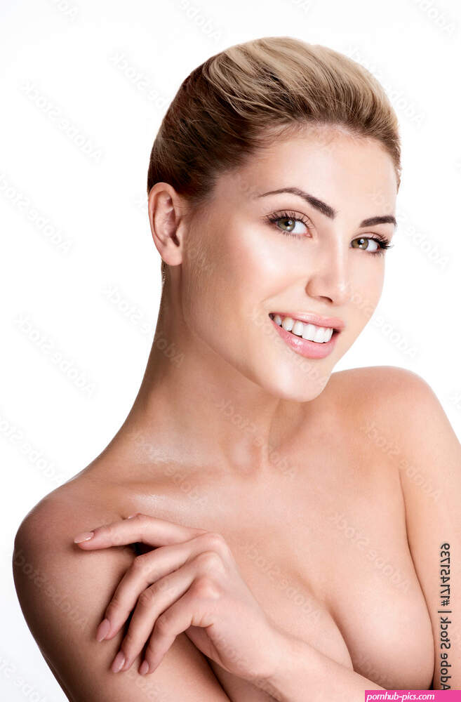 Beautiful young woman with clean skin nude topless breasts. Beautiful woman covering her nude breast. Stock Photo