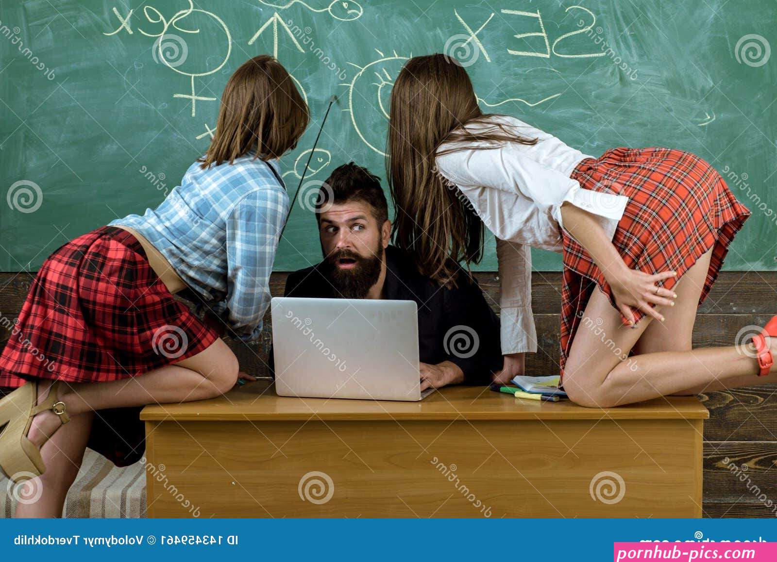Sexology Teacher Looks at Two Female Students. Erotic Education and Sex Symbols on Chalkboard. Stock Image