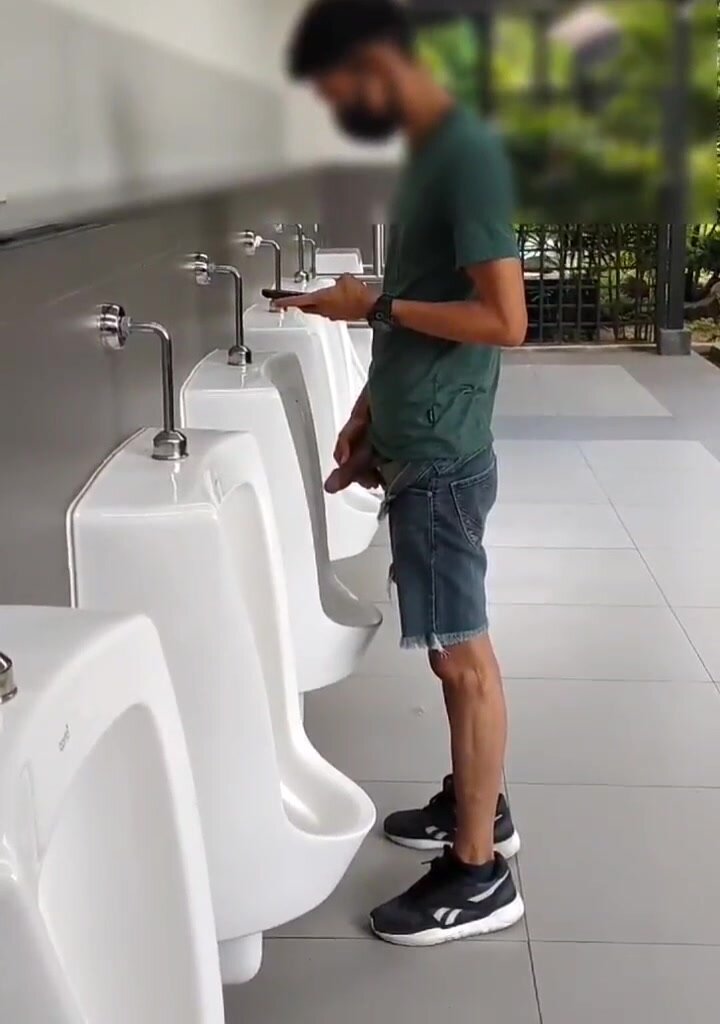 Huge cock at outdoor urinal
