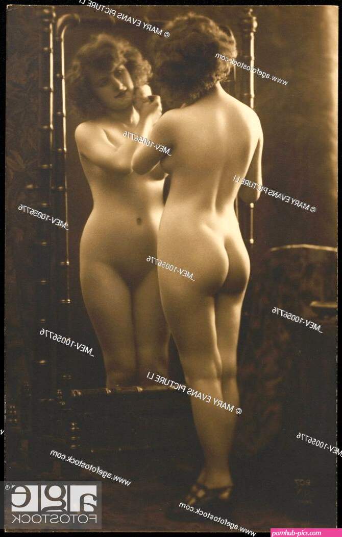 Nude girl poses in front of a mirror with a powder puff Stock Photo Picture And Rights Managed Image. Pic. MEV-10056776
