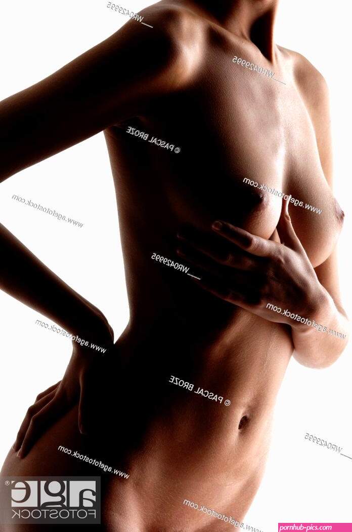 Mid section view of a naked young woman touching her breast Stock Photo Picture And Royalty Free Image. Pic. WR0429995