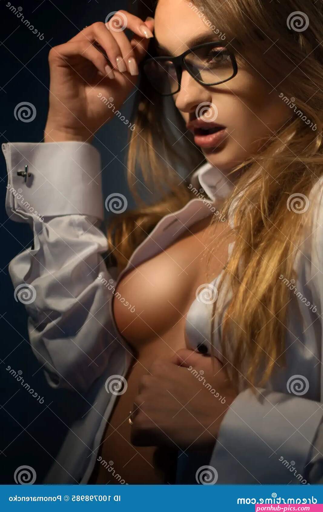Young Gorgeous Blonde with Big Boobs Wears a Glasses Looks Aside Stock Image
