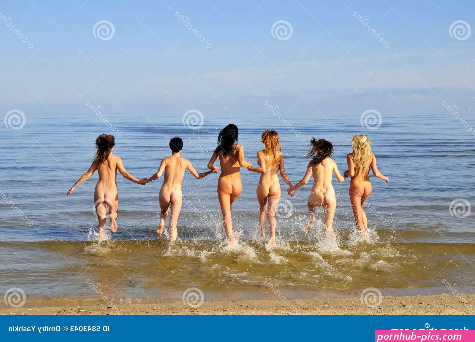 Naked Six Girls Running on the Beach Stock Image