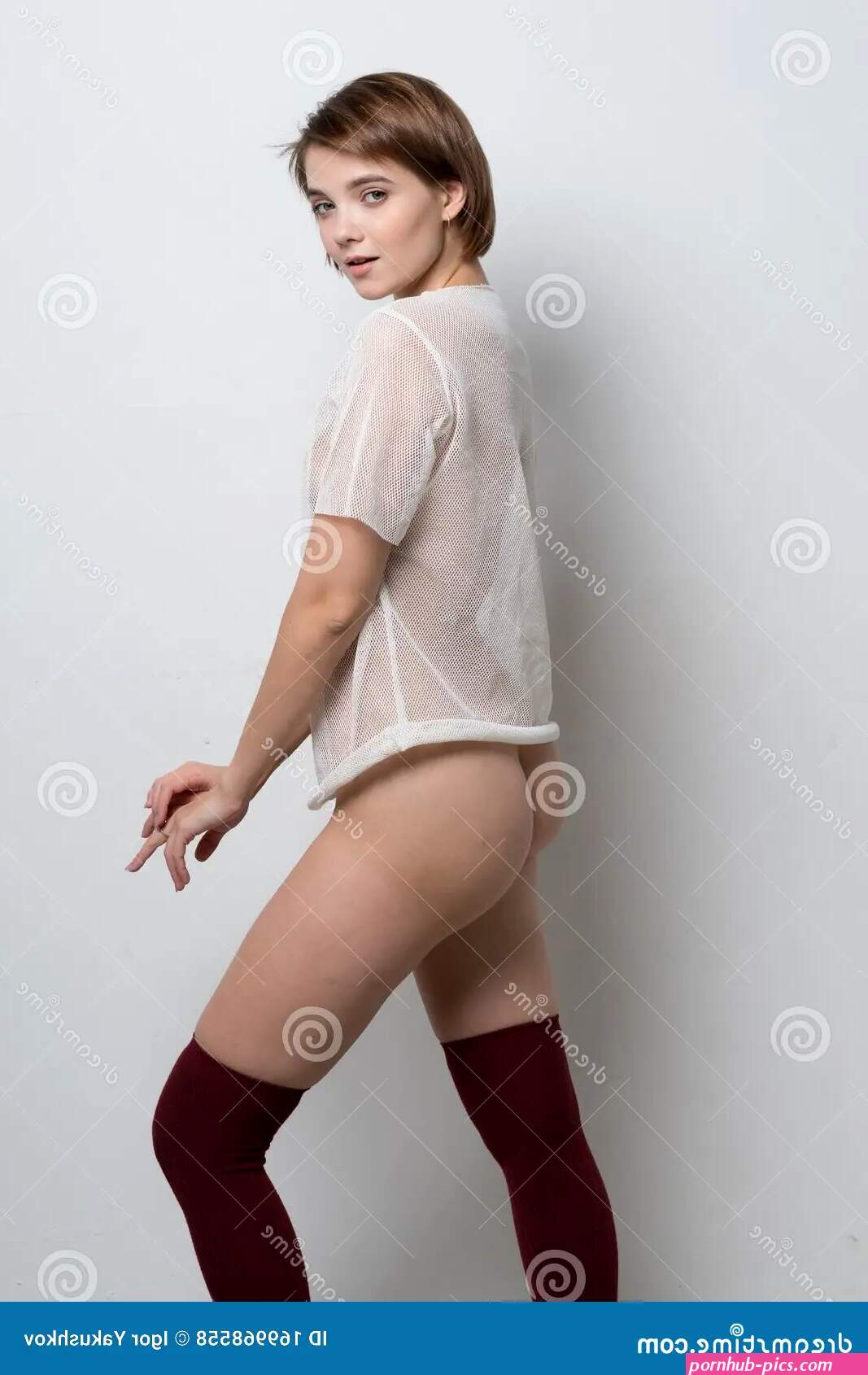 Young Beautiful Woman Posing Nude in the Studio Stock Photo