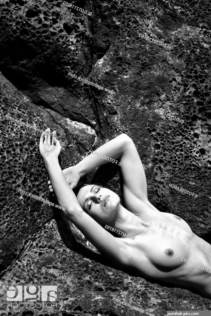 Close up of young adult nude woman laying on rocks Stock Photo Picture And Royalty Free Image. Pic. BLD-U12118193
