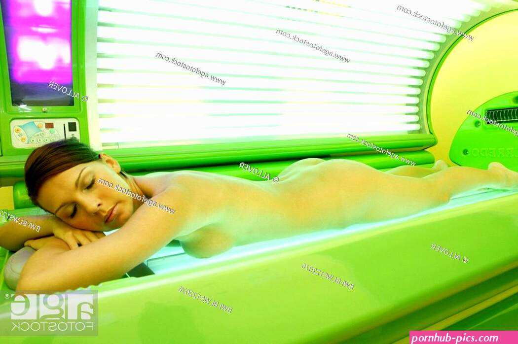 young naked woman lying on a tanning bed Stock Photo Picture And Rights Managed Image. Pic. BWI-BLWS122076