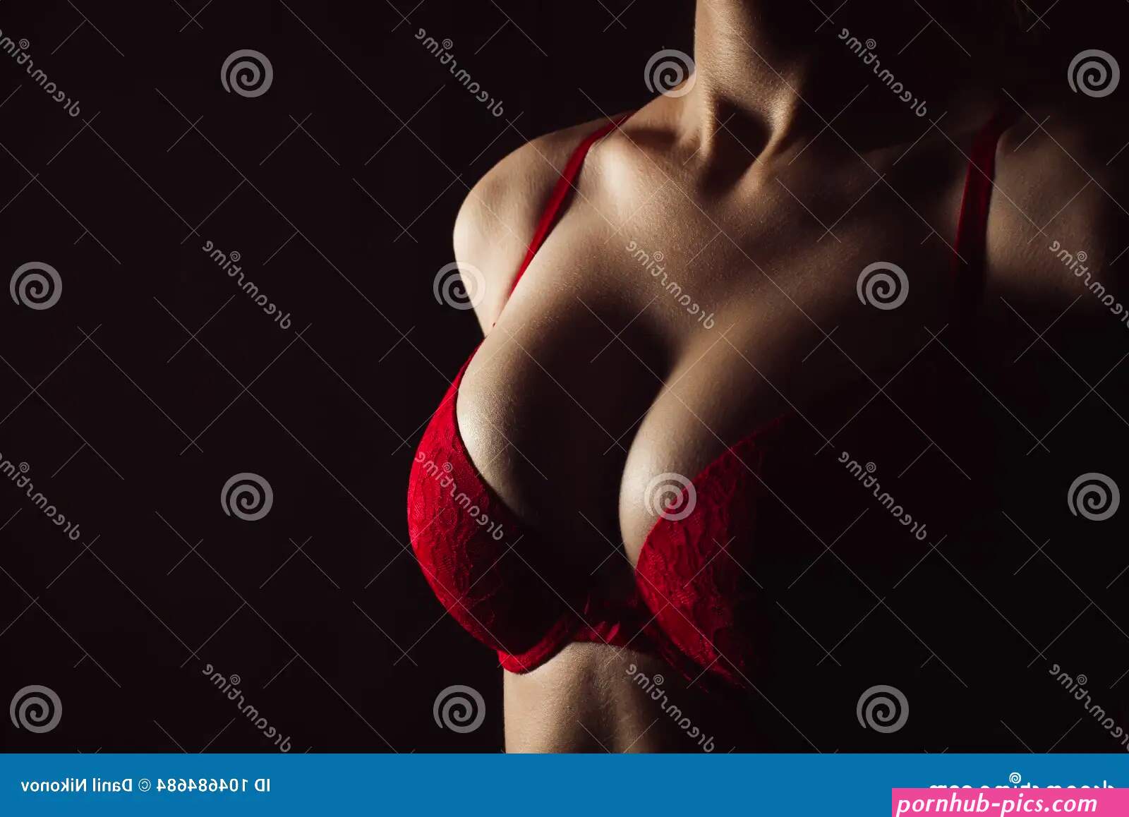 Woman with Hot Breasts in Lingerie. Seductive Red Bra and Big Boobs Stock Photo