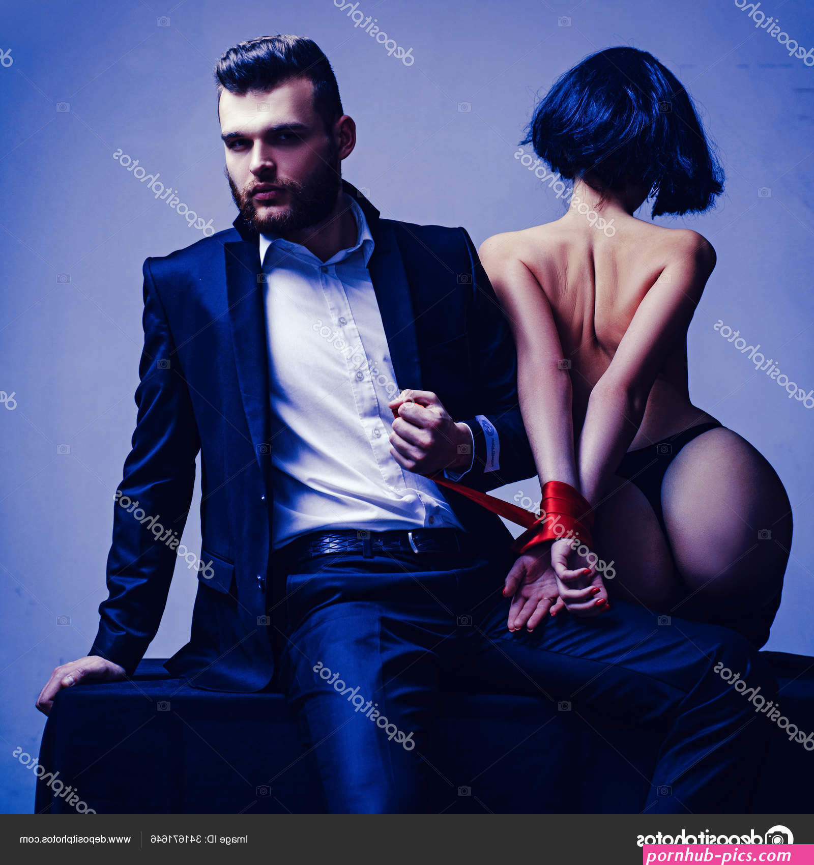 Tease and seduce. Sexy girl naked buttocks. Passionate lovers. Sex domination. Sex submission. Macho well groomed hipster and naked sexy woman tied hands red ribbon. Sexual relations. Sex game Stock Photo by