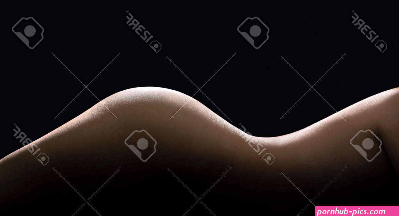 Female Body Curves In Dark. Sexy Shape And Figure Of A Beautiful Nude Woman. Slim Waist And Perfect Skin. Hot Erotic Naked Model. Side Torso Hips And Buttocks. Low Key Silhouette On