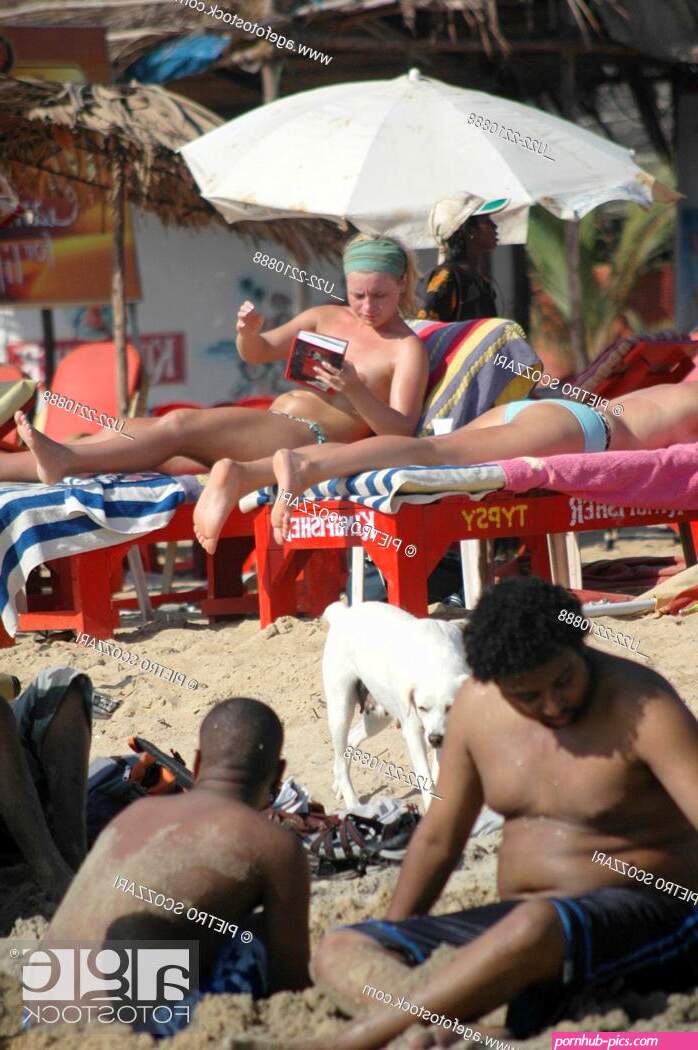 Calangute Goa India: careless British tourists in topless at the beach Stock Photo Picture And Rights Managed Image. Pic. U22-2210888