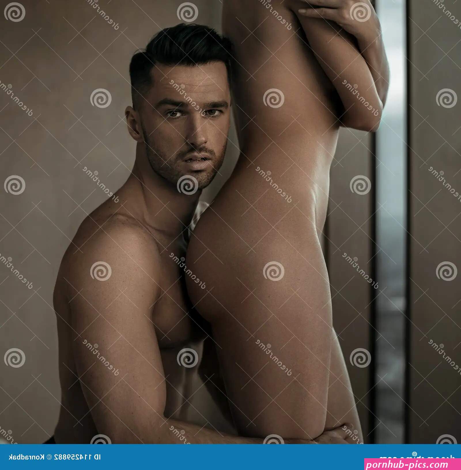 Handsome Man Hugging His Nude Wife Stock Photo