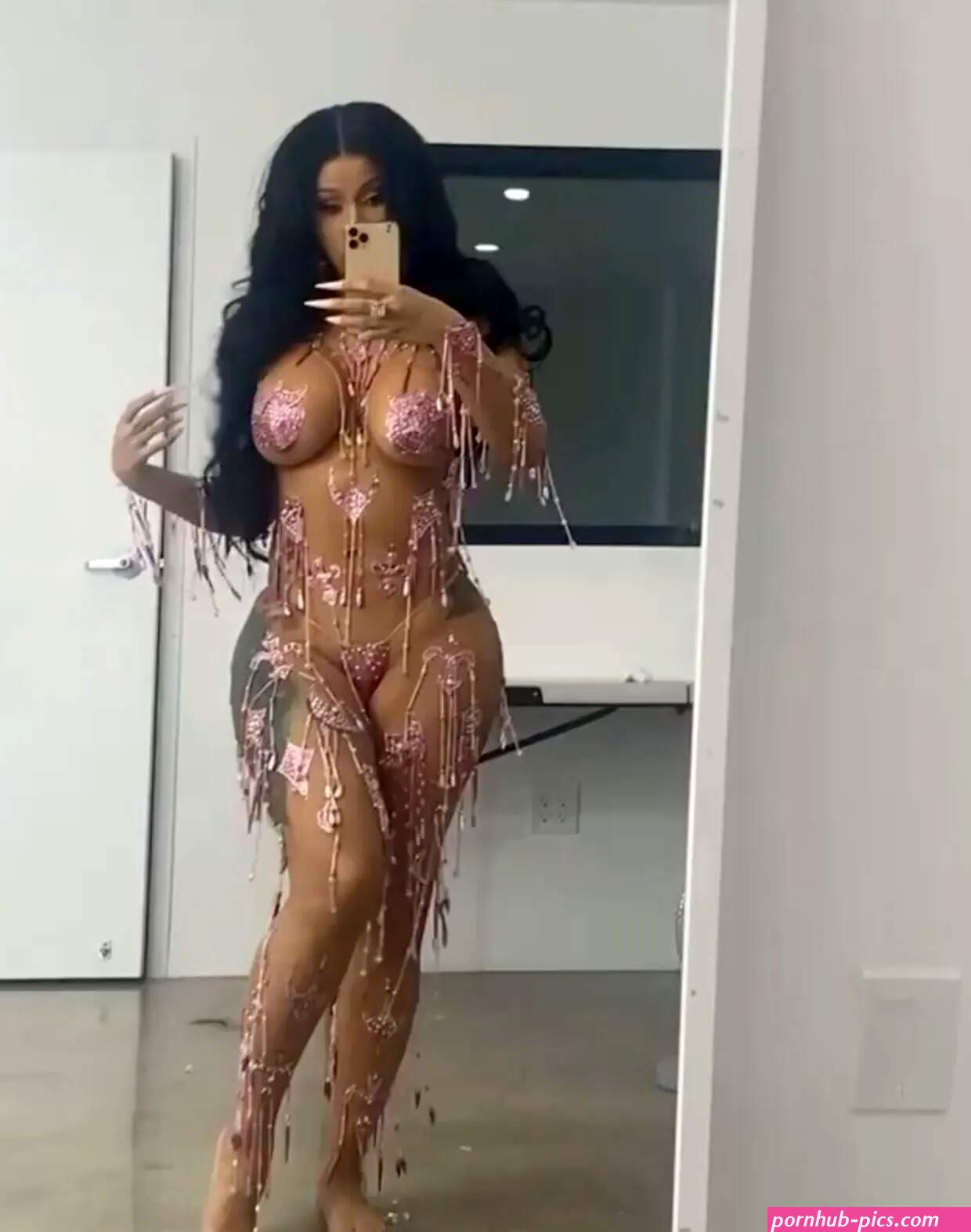 Cardi B goes nearly nude dances in JUST pink stickers beads as she promotes new single UP