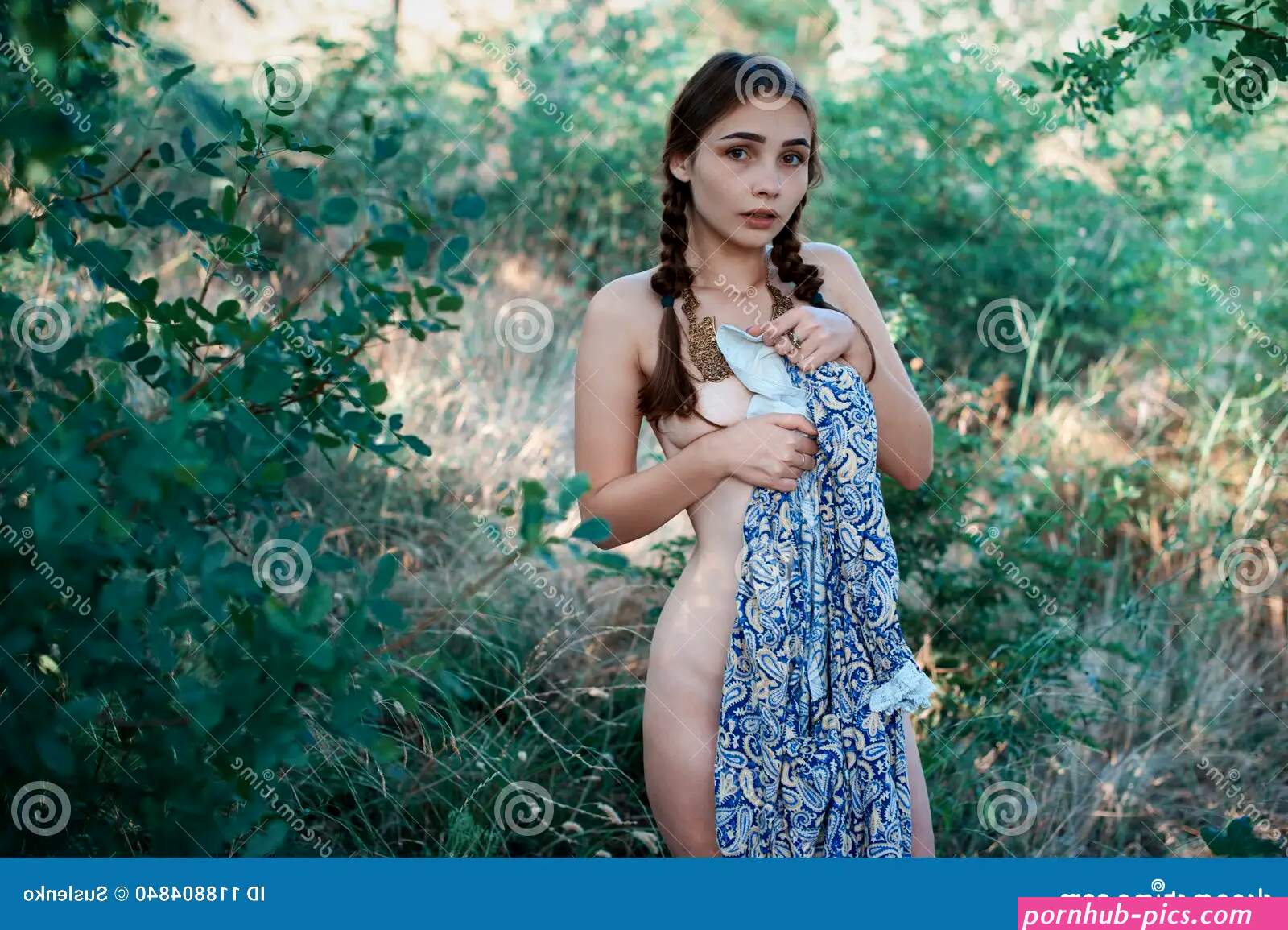 A Young Nude Girl Covered Her Nakedness with a Vintage Dress Stock Photo