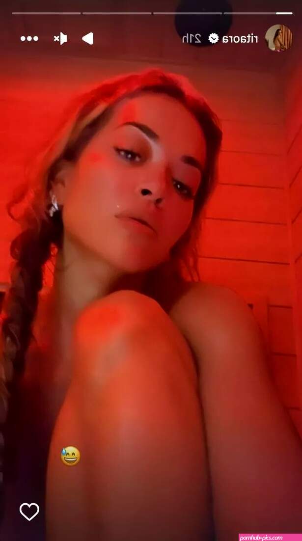 Rita Ora risks baring all as she strips naked for steamy sauna session display