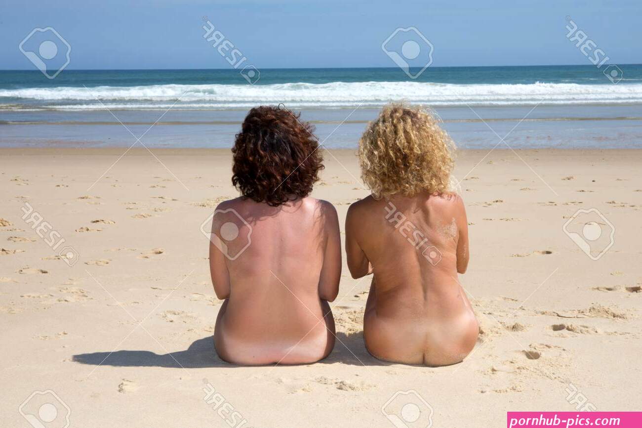 Couple Of Naturist Women Sitting On Beach Under Deep Blue Sky Stock Photo Picture and Royalty Free Image. Image 65731699.