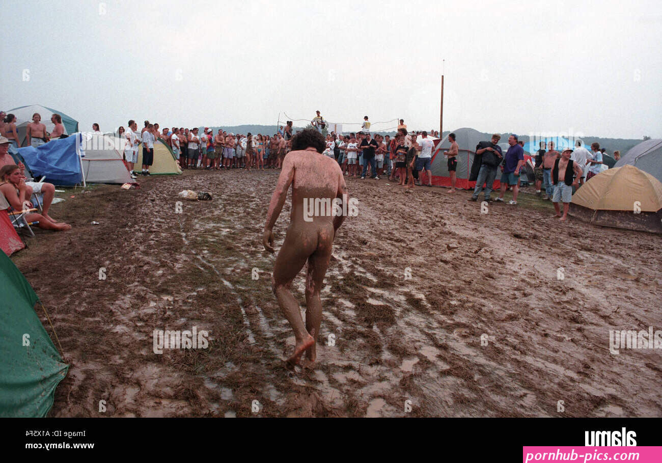 Naked nude man covered in mud Woodstock Music Festival 1994 USA Stock Photo