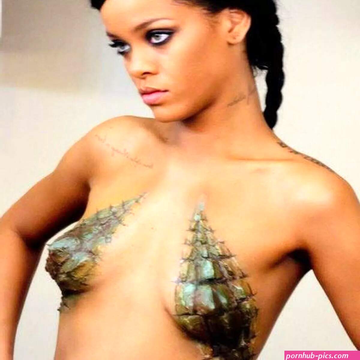 Rihanna gets boobs painted in croc skin kicks back with ready meal and relaxes