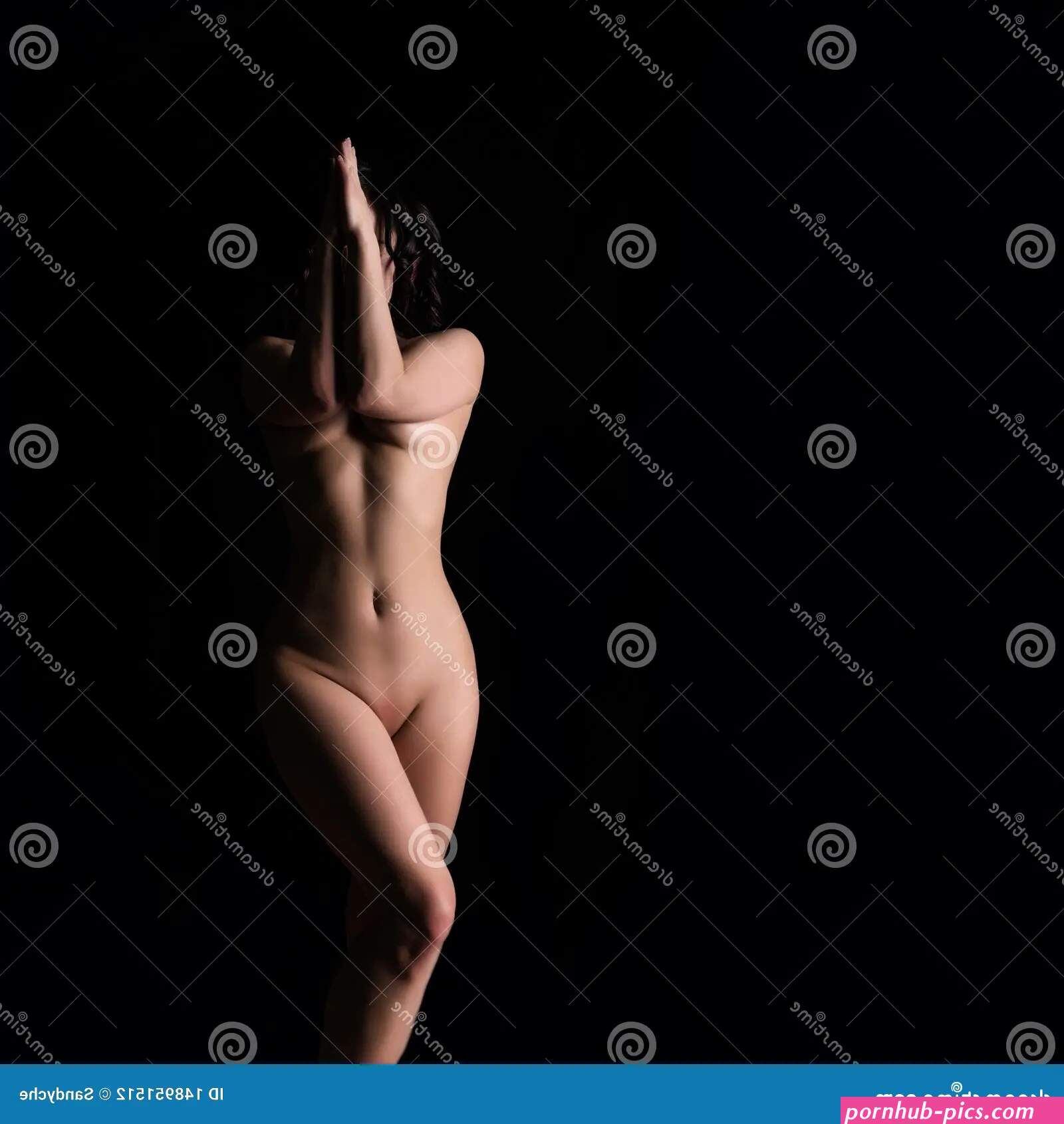 Silhouette of Seductive Woman on a Dark Background. Nude Athletic Female Body. Free Space for Your Text Stock Photo
