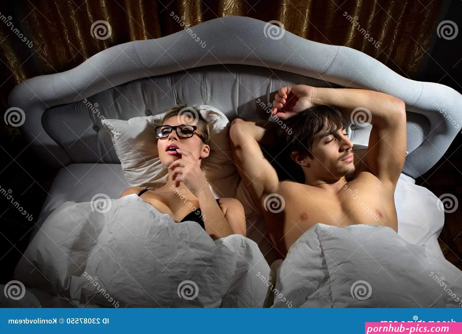 Woman Playing with Herself in Bed Stock Photo