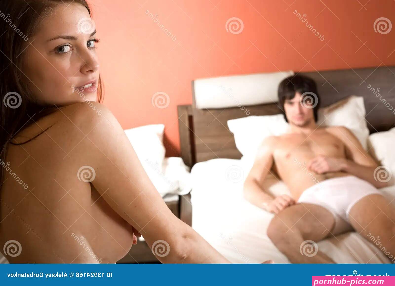 Boy in bed and naked girl stock photo. Image of loving