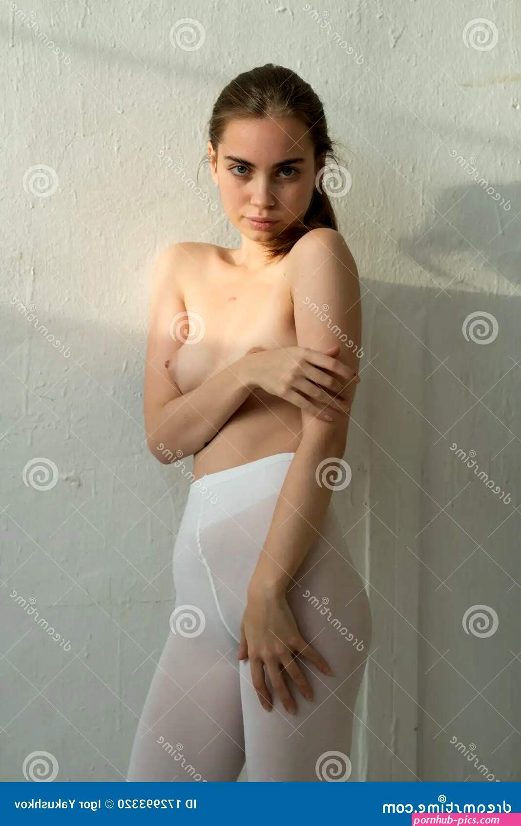 Young Beautiful Girl Posing Nude in Studio Stock Photo