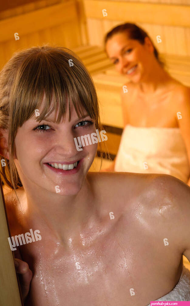Two young women in sauna hi-res stock photography and images