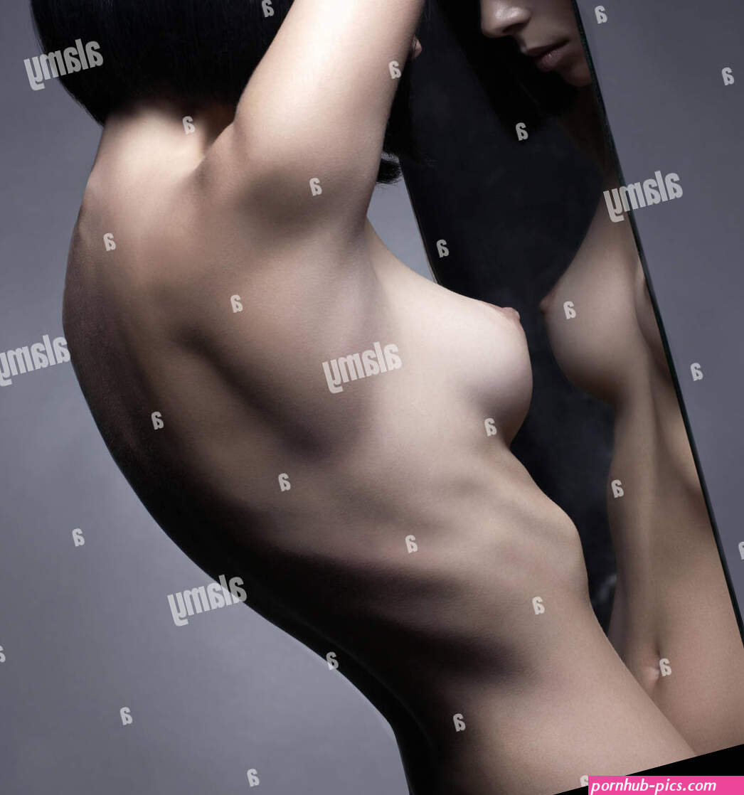 Elegant beautiful nude woman with perfect sexy body. Naked elegant lady pose in studio. Art photography of nude sexy woman Stock Photo