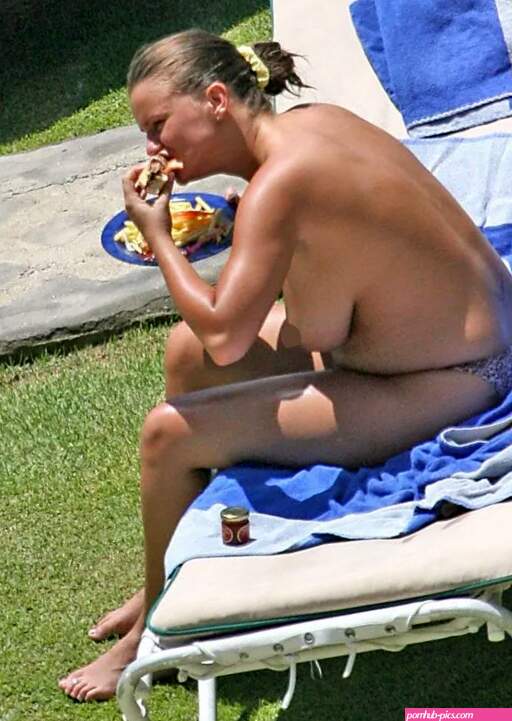 How Kerry Katona has made a career out of posing for belly-grabbing beach photoshoots for over a decade