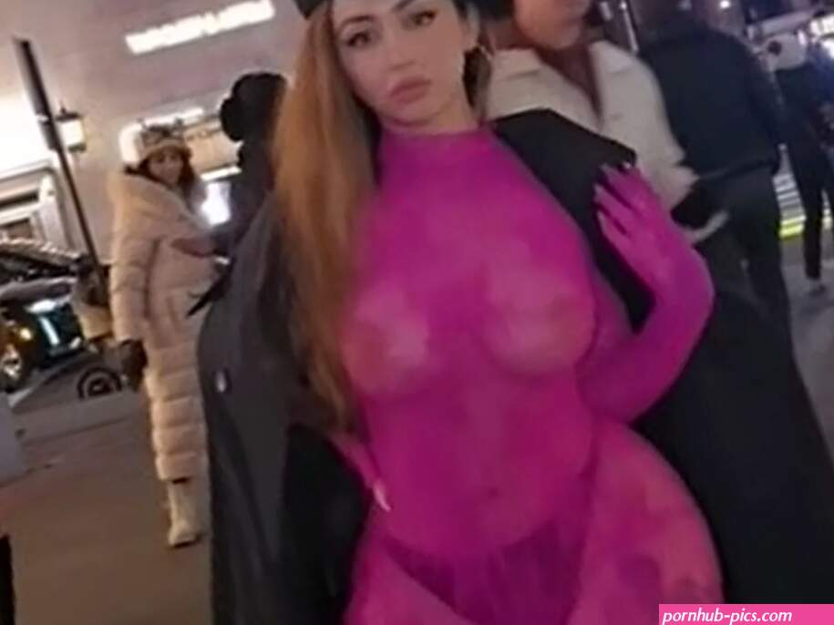 Curvy model strips to see-through catsuit on street making people stop and stare