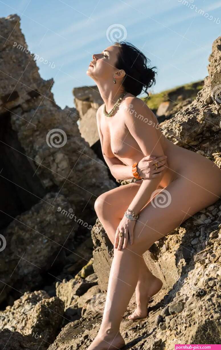 Young Beautiful Naked Woman Enjoying Summer Time at the Beach. Stock Photo