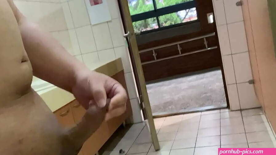 Jerking naked in public restroom