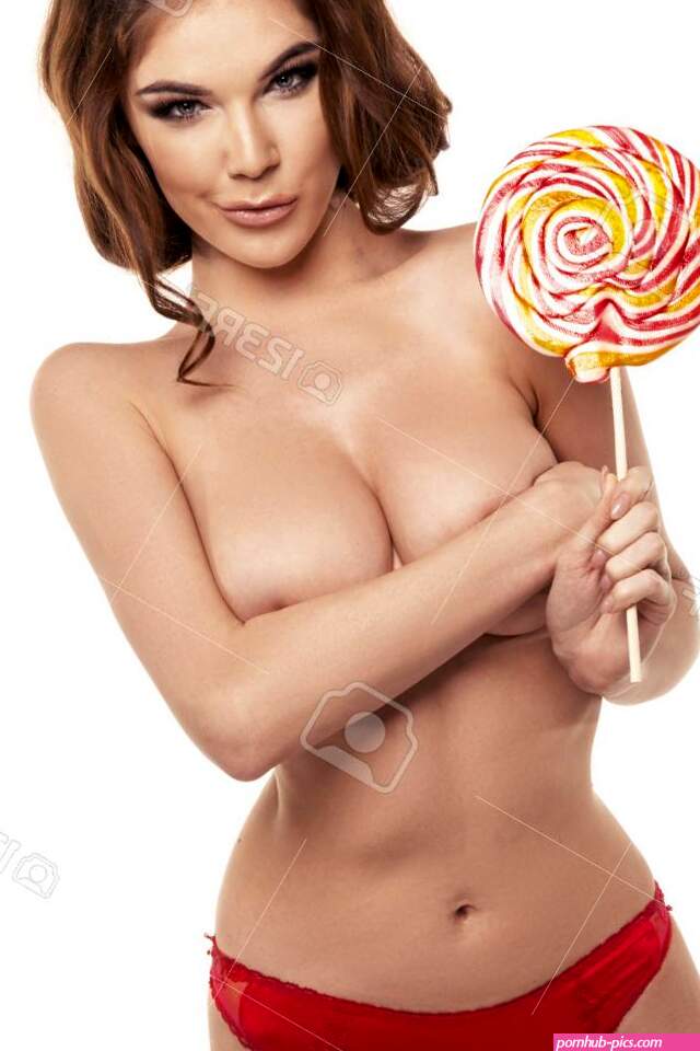 Portrait Of A Smiling Cute Girl Covering Her Breast With Lollipop Stock Photo Picture and Royalty Free Image. Image 52917725.