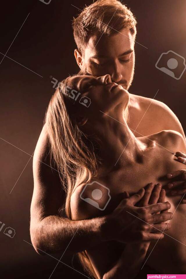 Handsome Boyfriend Touching Breast Of His Sexy Girlfriend On Brown Stock Photo Picture and Royalty Free Image. Image 114542508.